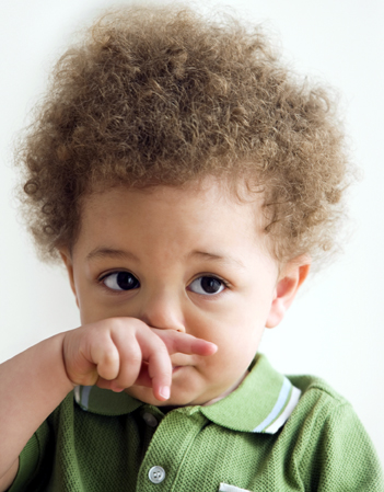 Mixed Race baby rubbing nose