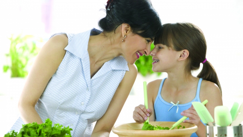 Mother and Daughter Making a Salad