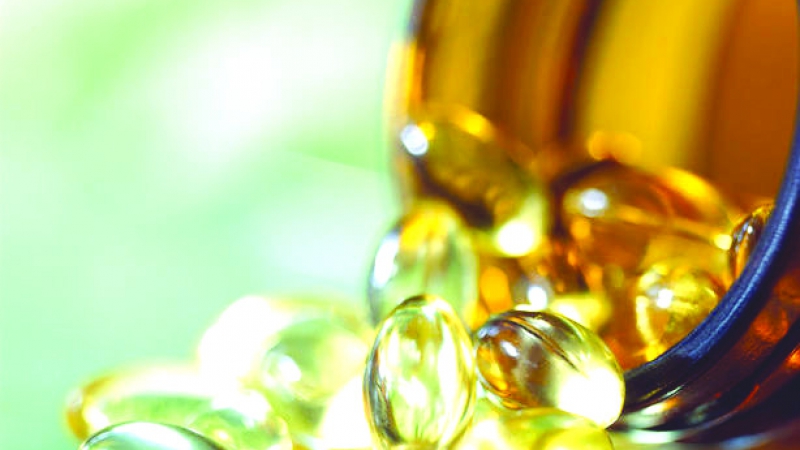 Pills Pouring out of Bottle